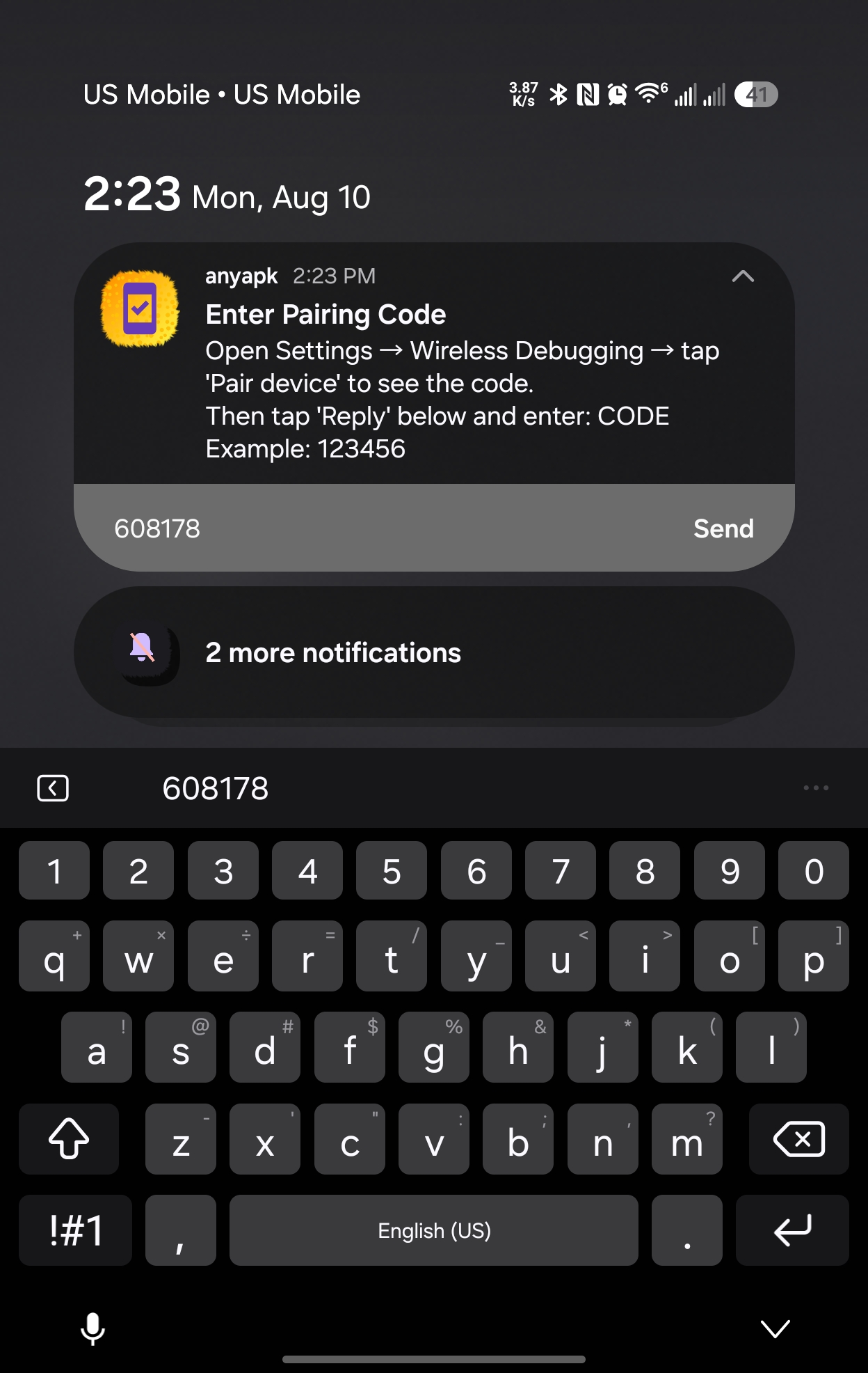 Notification shade pulled down with the pairing code typed into anyapk's notification reply field