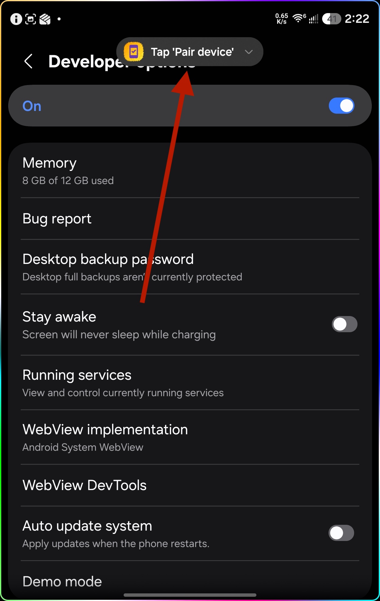 Developer Options screen with the anyapk notification appearing at the top saying Tap Pair device
